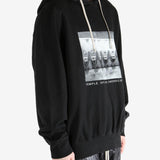 Black hoodie worn by a person, showing the hoodie's fit