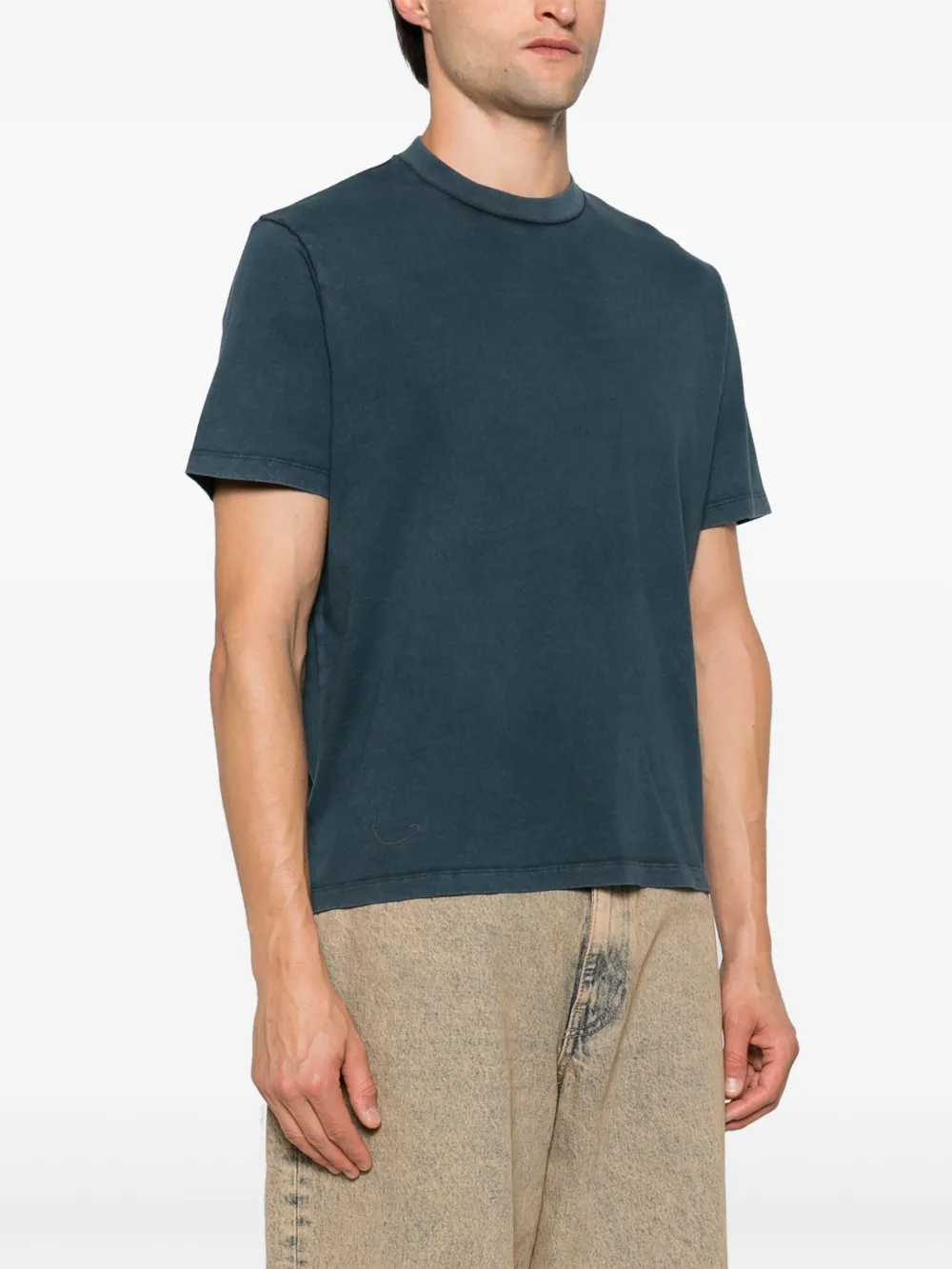 Blue shirt worn by a person, showing the shirt's fit