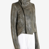 Green jacket worn by a person, showing the jacket fit