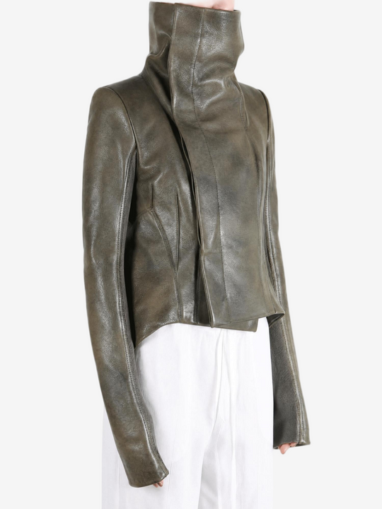 Green jacket worn by a person, showing the jacket fit