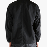 Black jackets worn by a person, showing the jackets fit