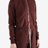 Burgundy hoodies worn by a person, showing the hoodies fit