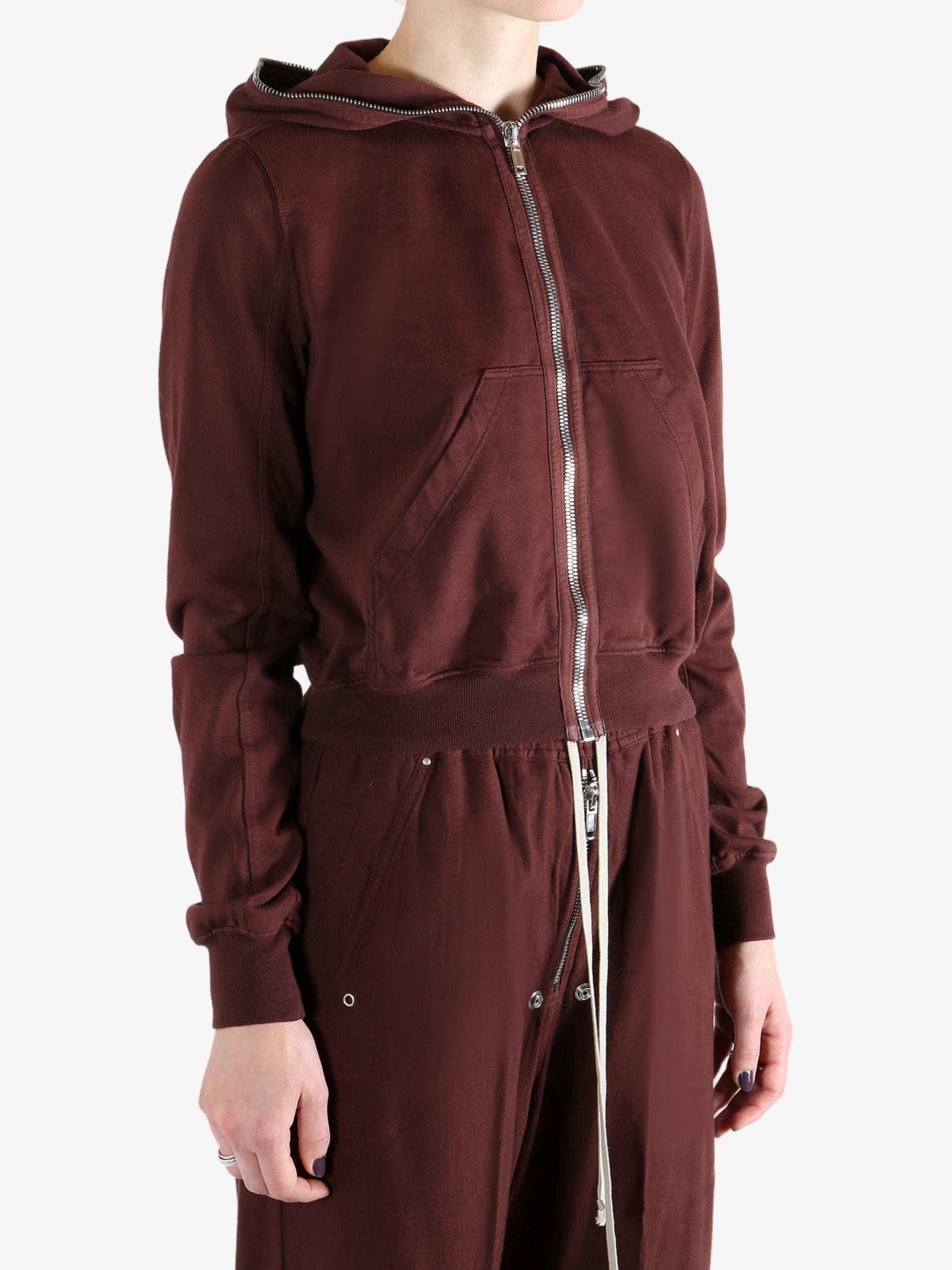 Burgundy hoodies worn by a person, showing the hoodies fit