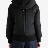 Black jacket worn by a person, showing the jacket's fit