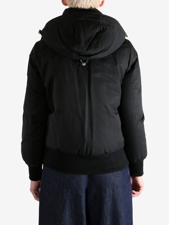 Black jacket worn by a person, showing the jacket's fit