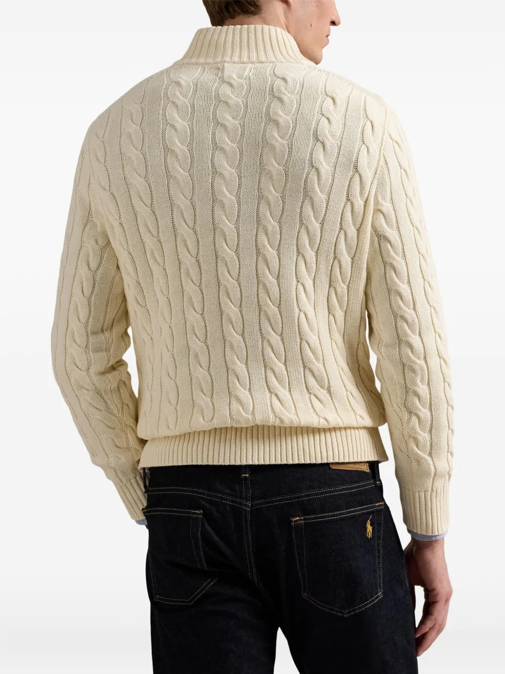 Creme sweater worn by a person, showing the sweater's fit