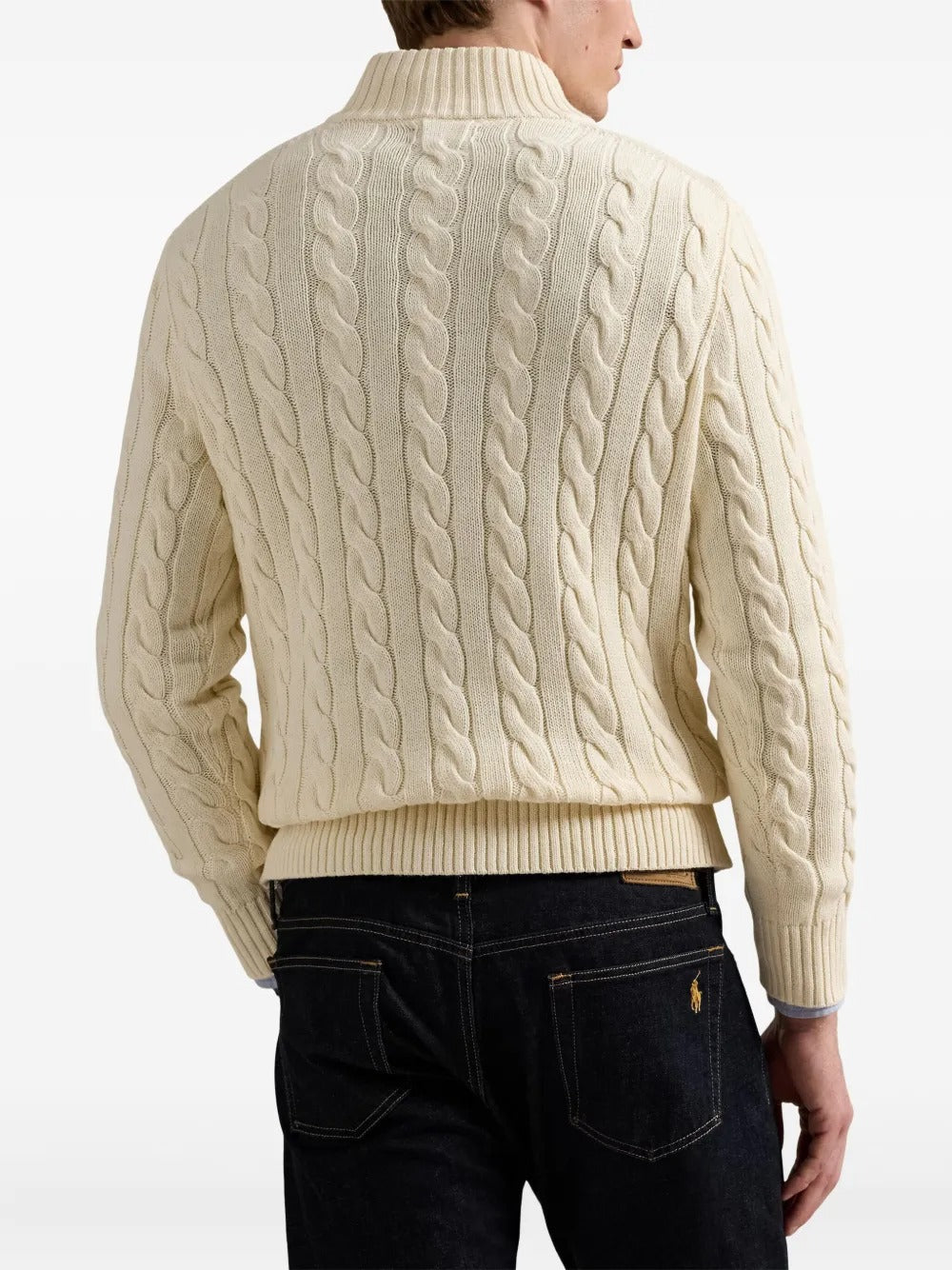 Creme sweater worn by a person, showing the sweater's fit