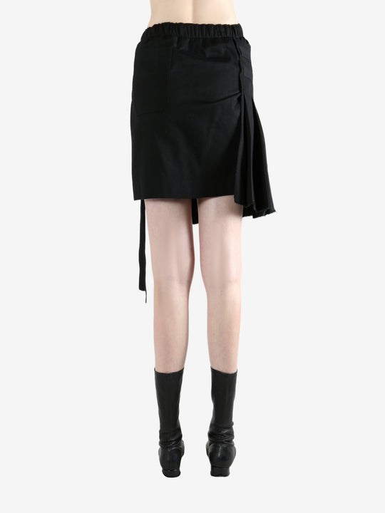 Black skirt worn by a person, showing the skirt's fit