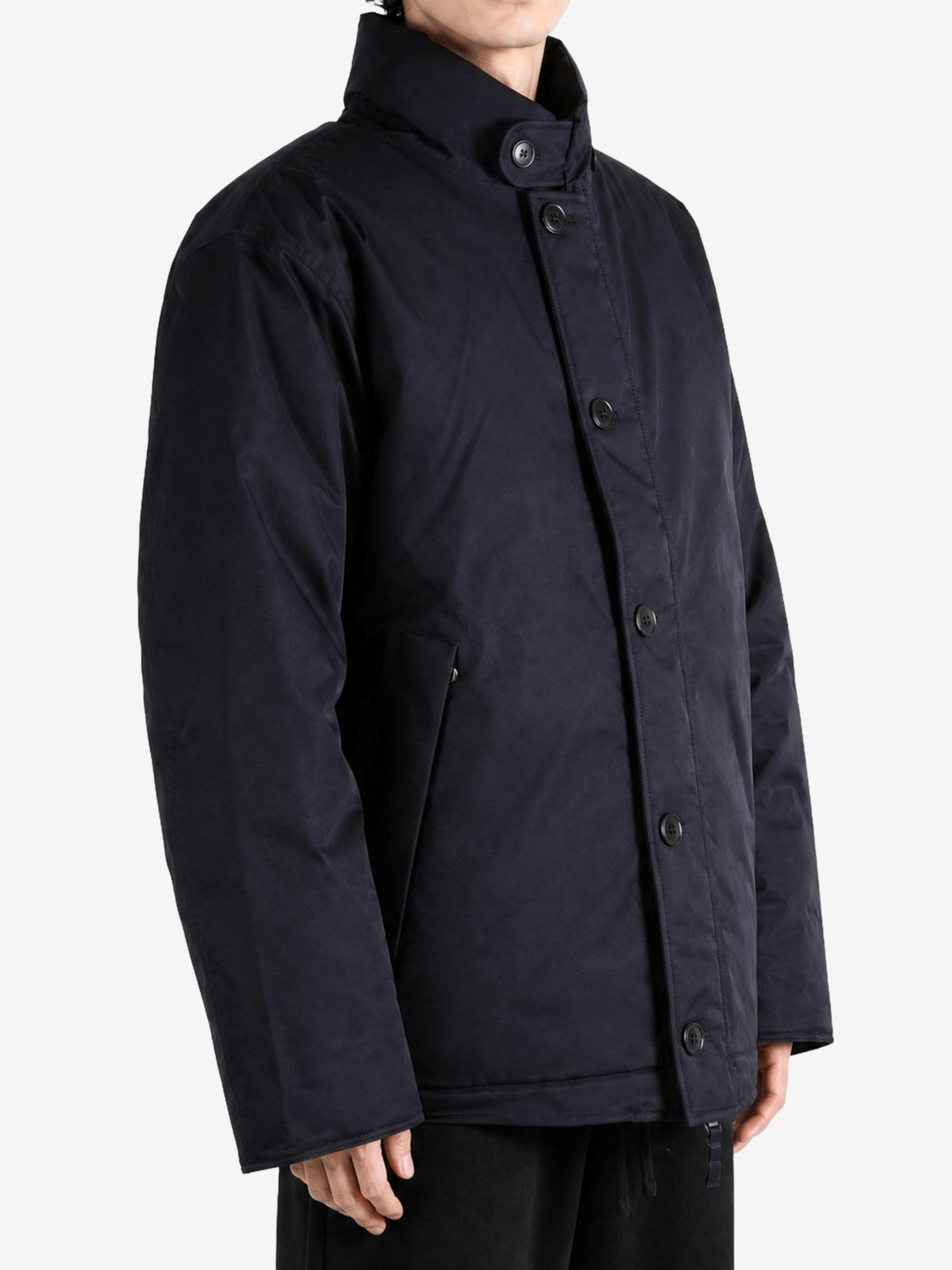 Navy jacket worn by a person, showing the jacket fit