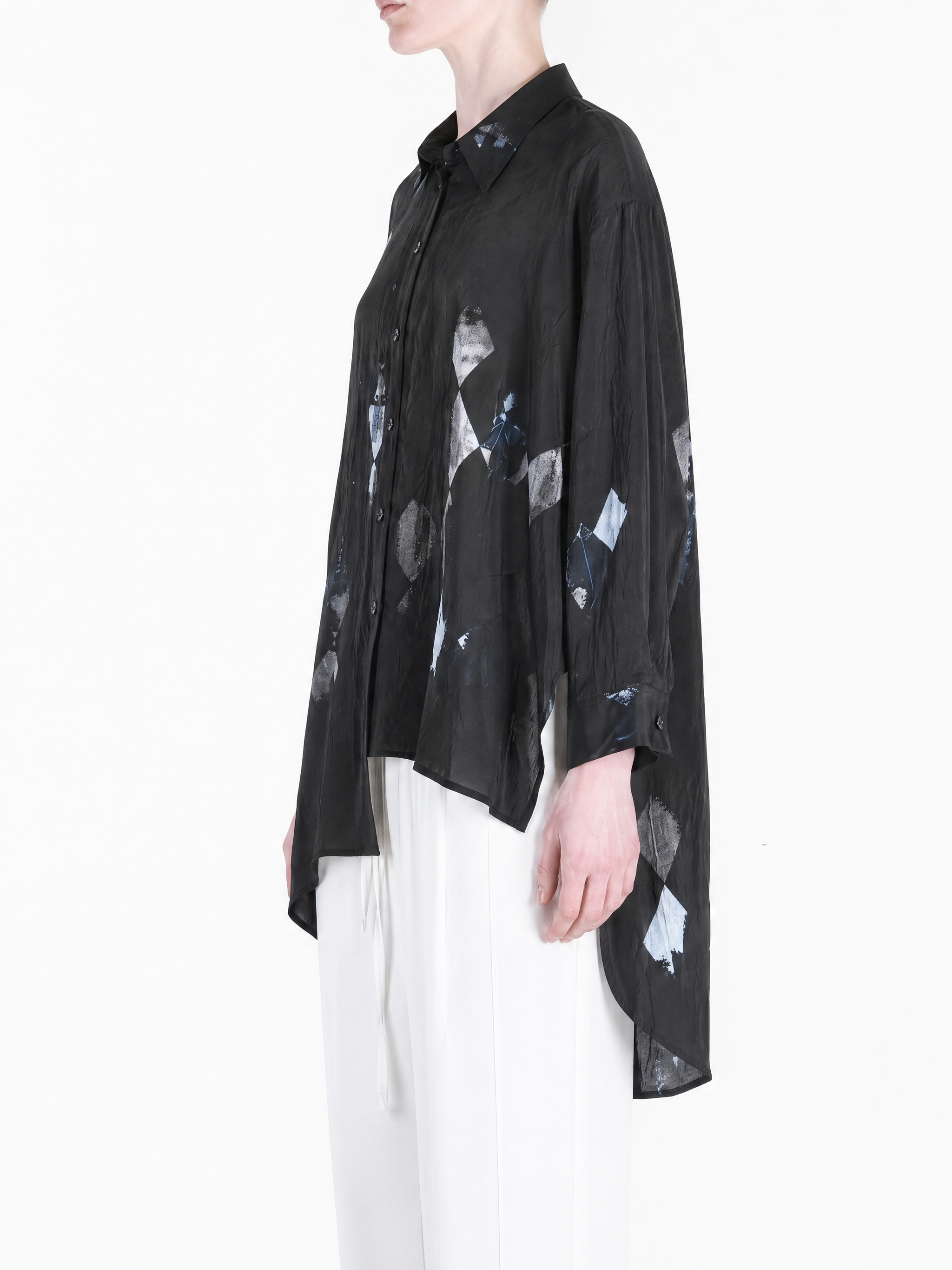 Black shirt worn by a person, showing the shirt fit