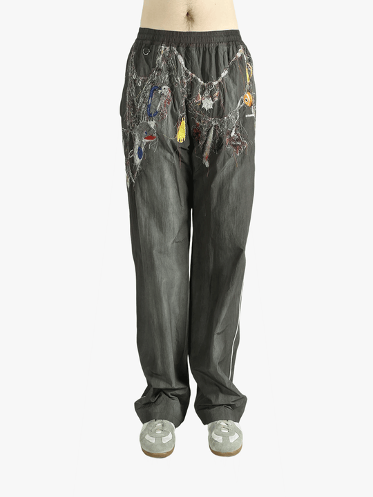 Grey pant worn by a person, showing the pant's fit