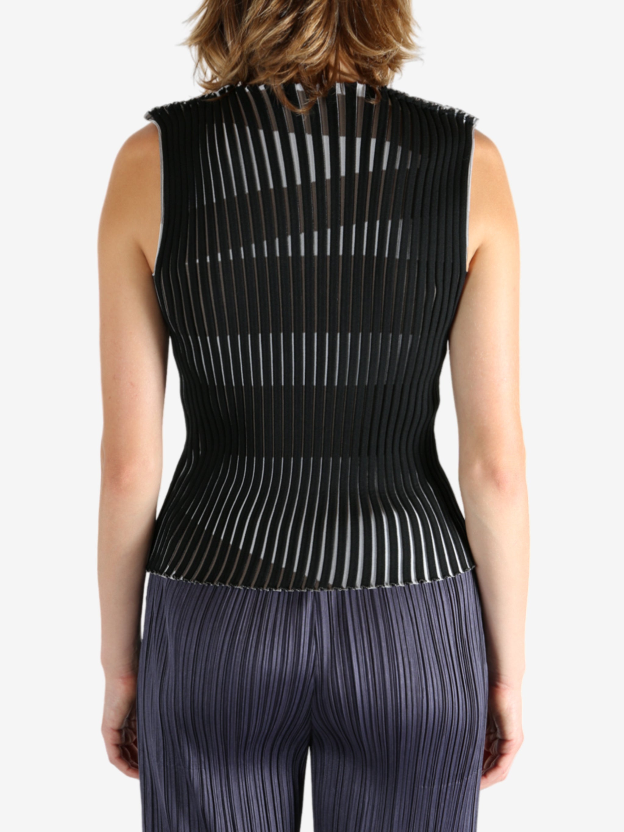 Black shirt worn by a person, showing the shirt's fit