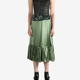 Green top, full body view