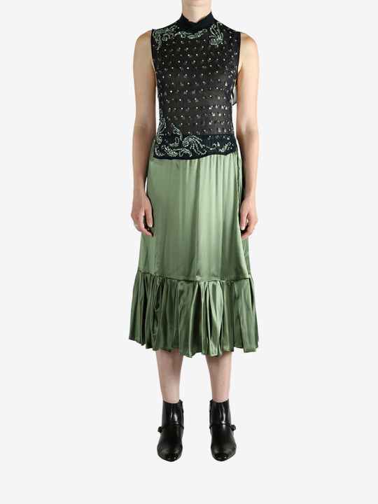 Green top, full body view