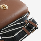 Close up of brown bag, showing texture of the Cow Leather w fabric