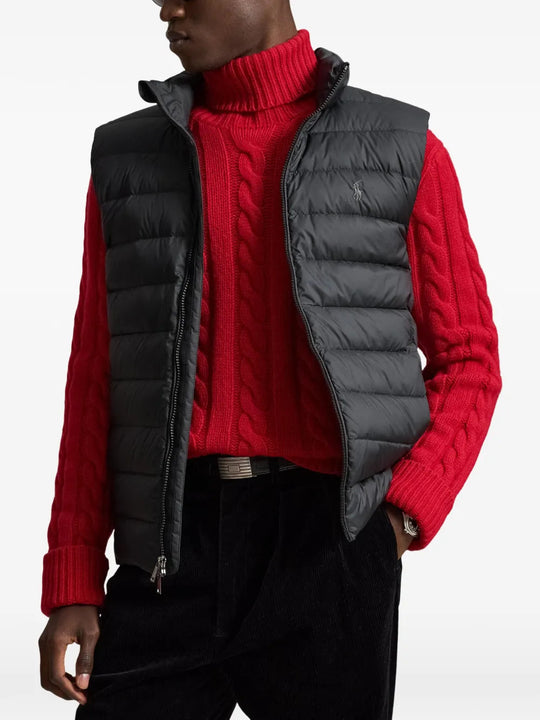 Black jacket worn by a person, showing the jacket fit