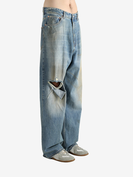 Blue pants worn by a person, showing the pants fit