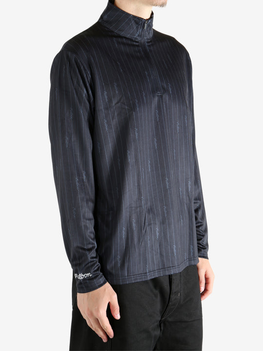 Black pullover worn by a person, showing the pullover's fit