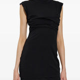 Black dress worn by a person, showing the dress fit