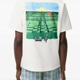 White t-shirt worn by a person, showing the white t-shirt's fit