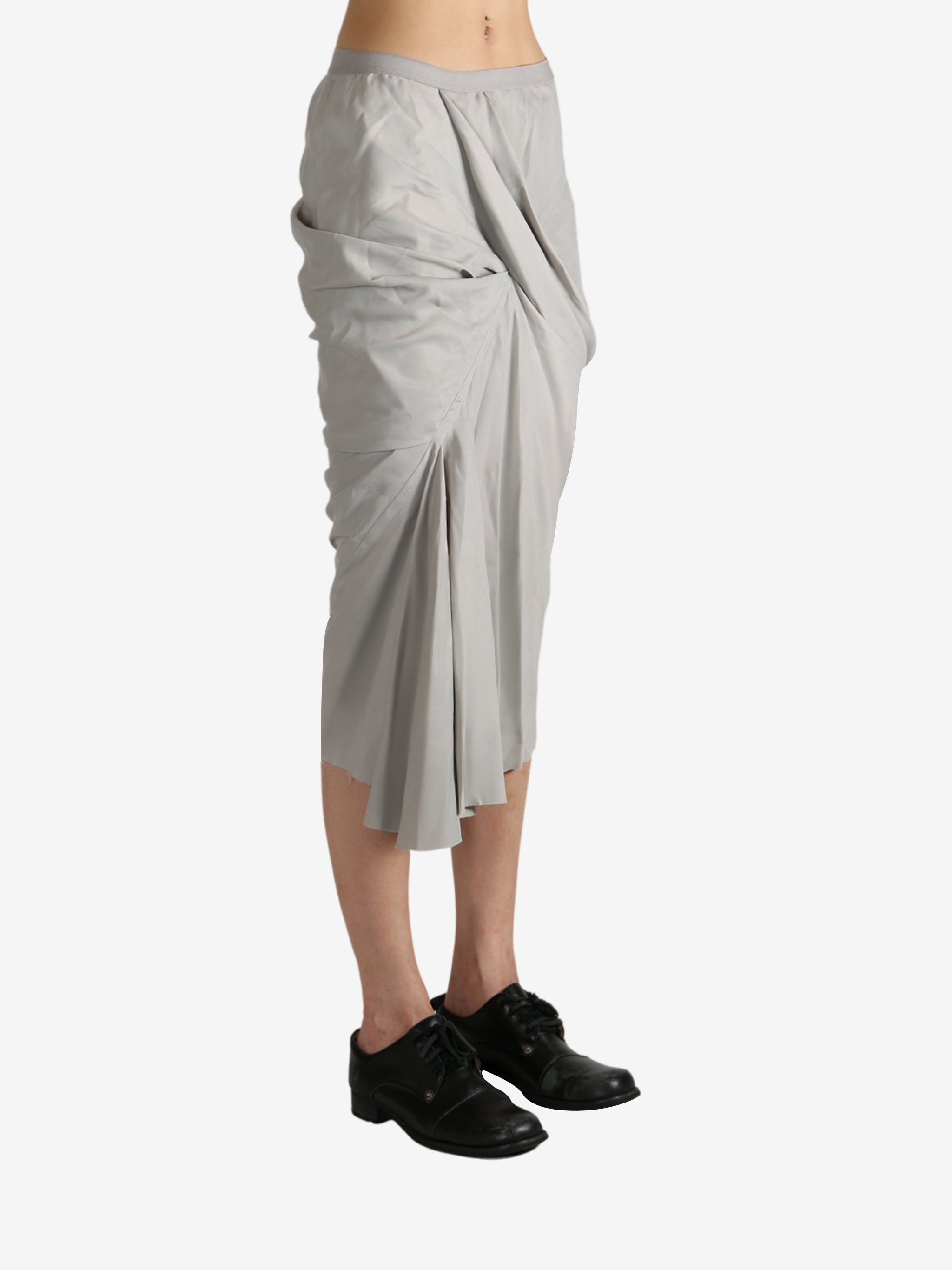 Grey skirt worn by a person, showing the skirt's fit