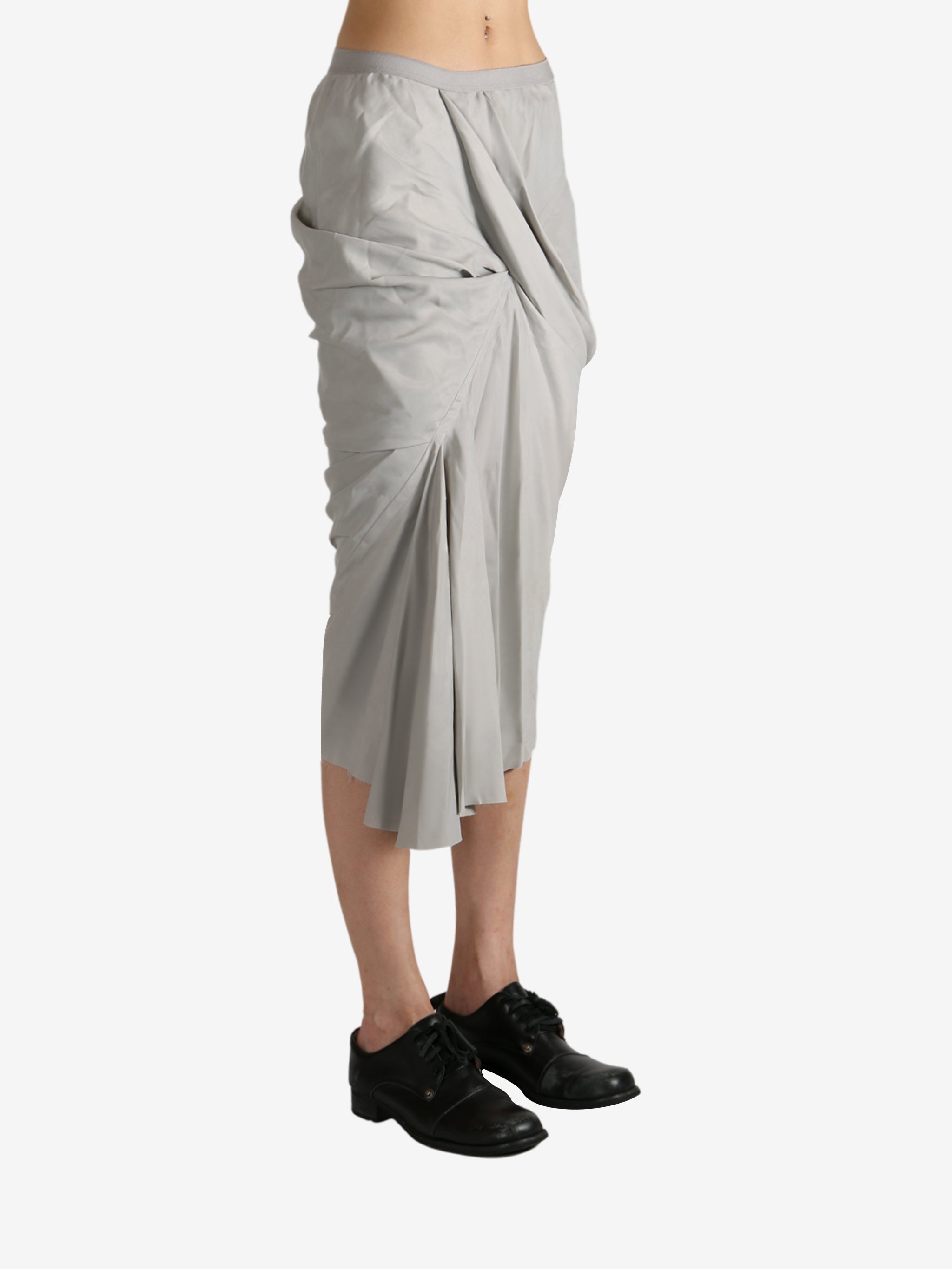 Grey skirt worn by a person, showing the skirt's fit