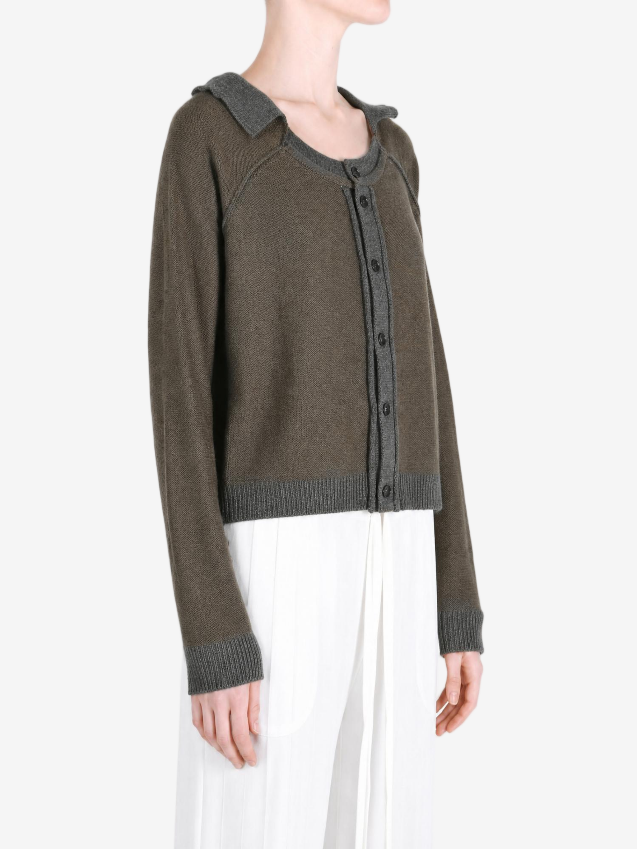 Green top worn by a person, showing the top fit