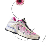Cloes-up of pink sneaker, showing texture of the fabric