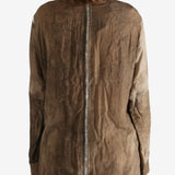 Brown shirt worn by a person, showing the shirt's fit