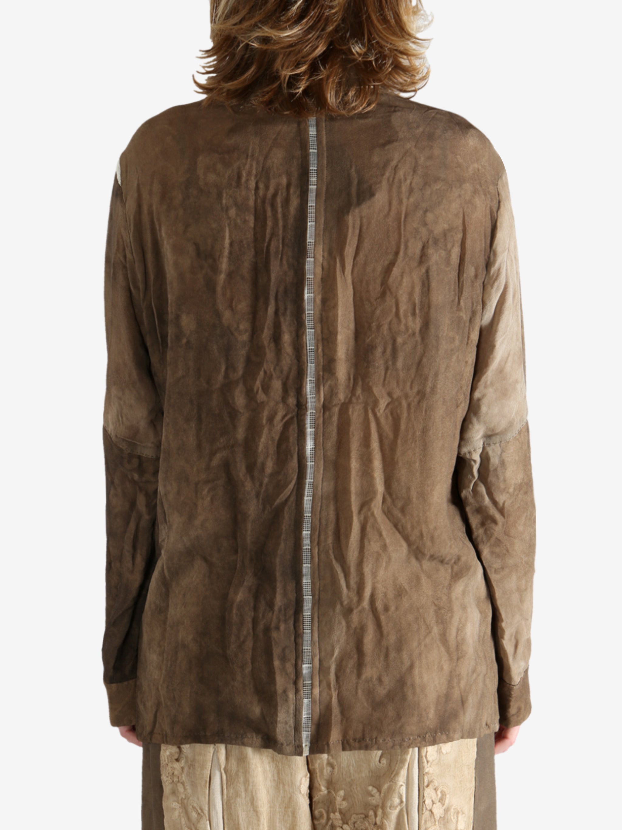 Brown shirt worn by a person, showing the shirt's fit