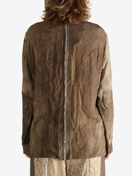 Brown shirt worn by a person, showing the shirt's fit