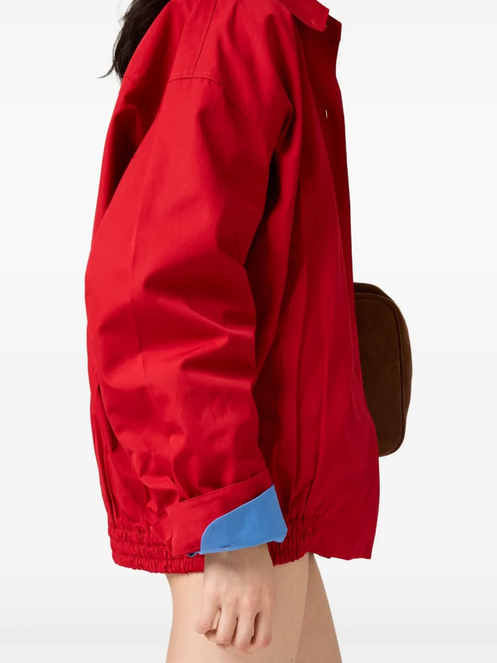 Red jacket worn by a person, showing the jacket's fit