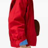 Red jacket worn by a person, showing the jacket's fit