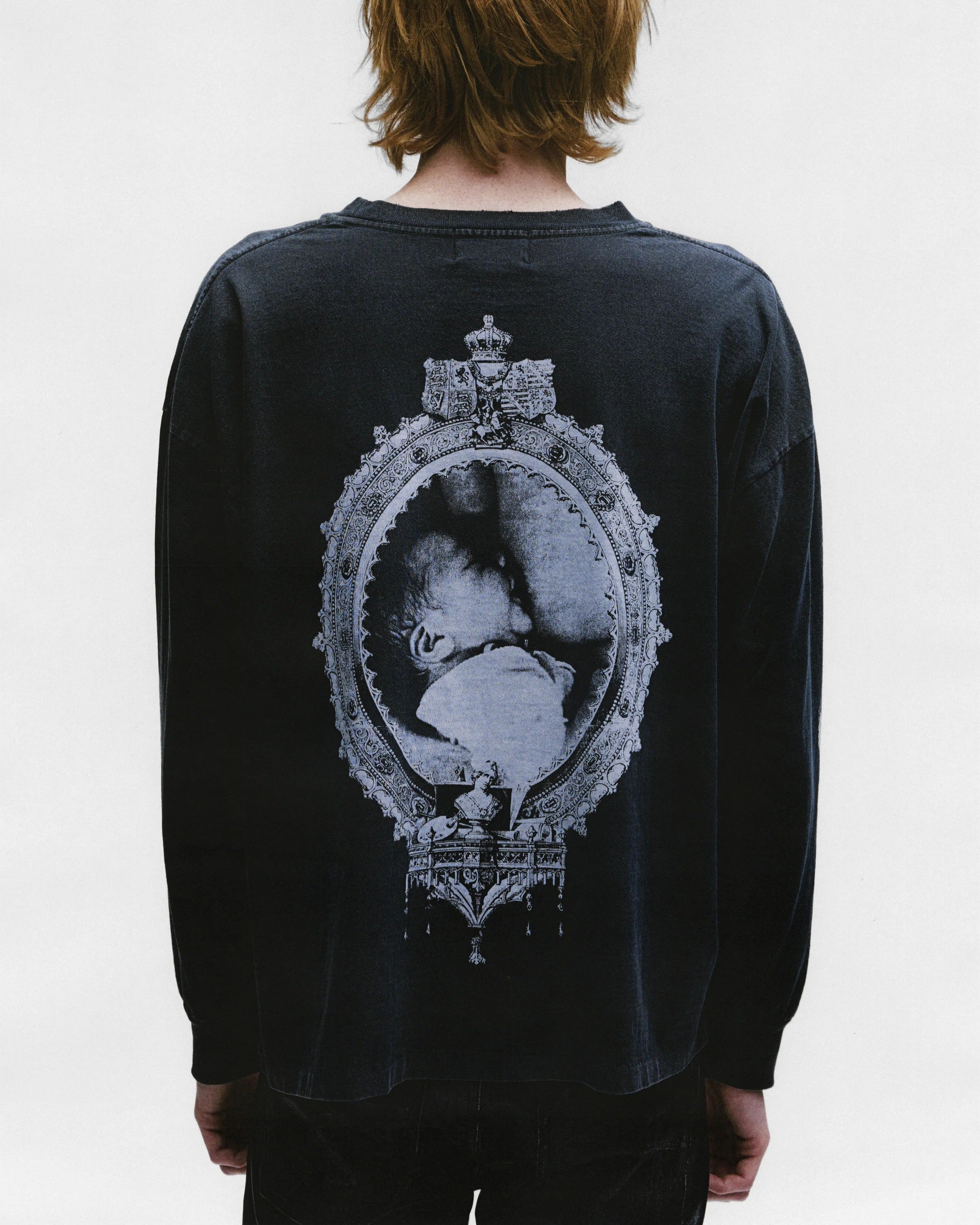 Black shirts worn by a person, showing the shirts fit