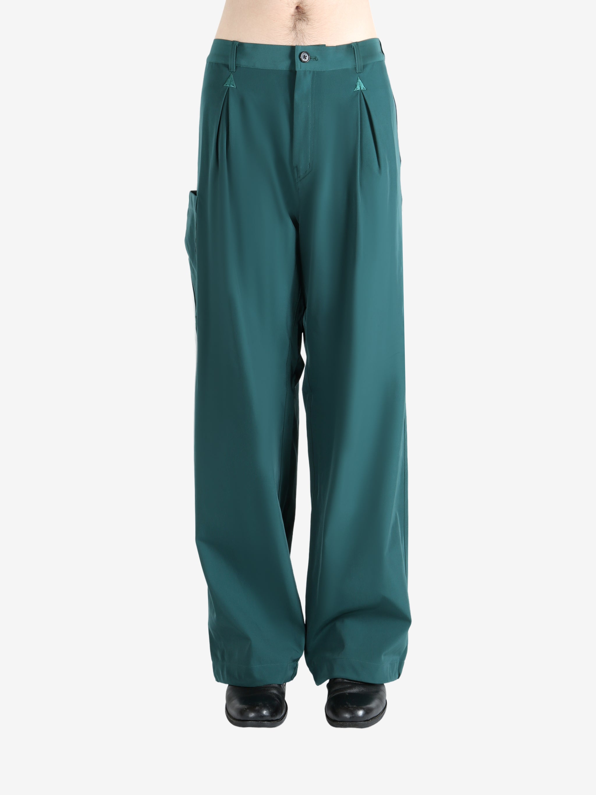 Blue pants worn by a person, showing the pants' fit