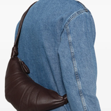 Brown bag worn by a person, showing the bag's fit