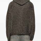 Brown jackets worn by a person, showing the jackets fit