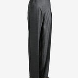 Grey pants worn by a person, showing the pants fit