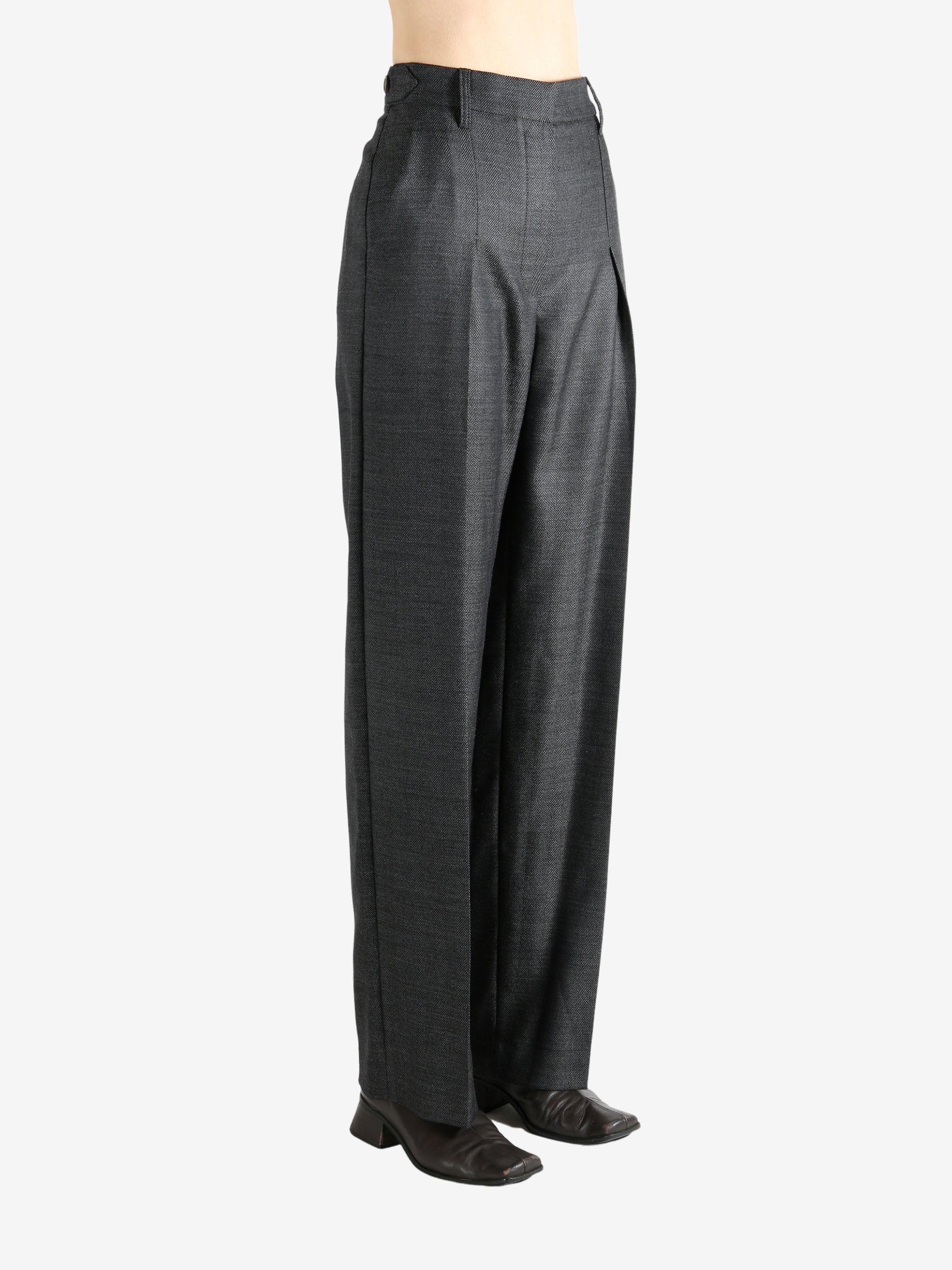 Grey pants worn by a person, showing the pants fit