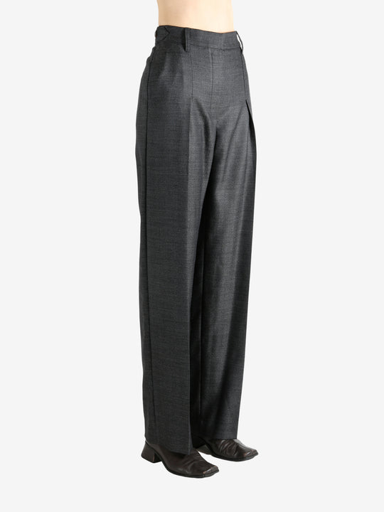 Grey pants worn by a person, showing the pants fit