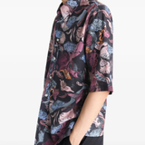 Black shirt worn by a person, showing the shirt's fit