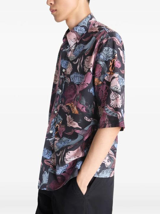 Black shirt worn by a person, showing the shirt's fit