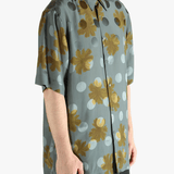 Navy shirt worn by a person, showing the shirt's fit