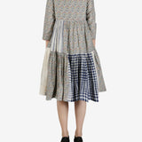 Grey dress worn by a person, showing the dress' fit