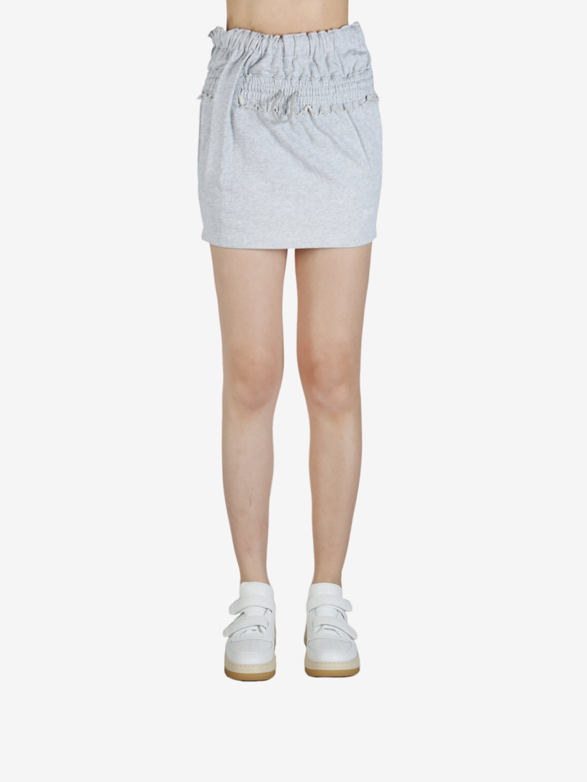 Grey skirt worn by a person, showing the skirt's fit