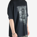 Black shirt worn by a person, showing the shirt fit