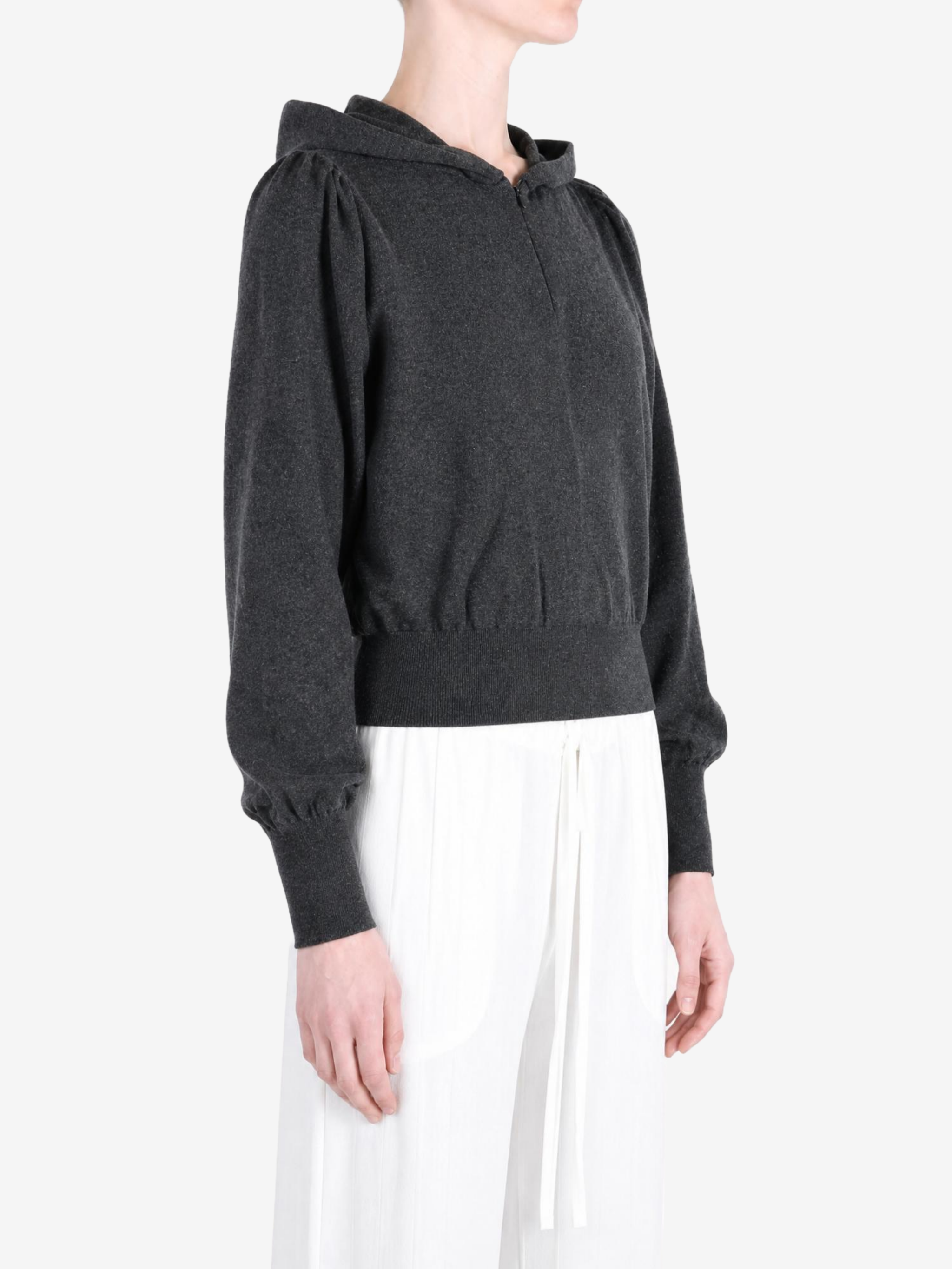 Grey hoodie worn by a person, showing the hoodie fit