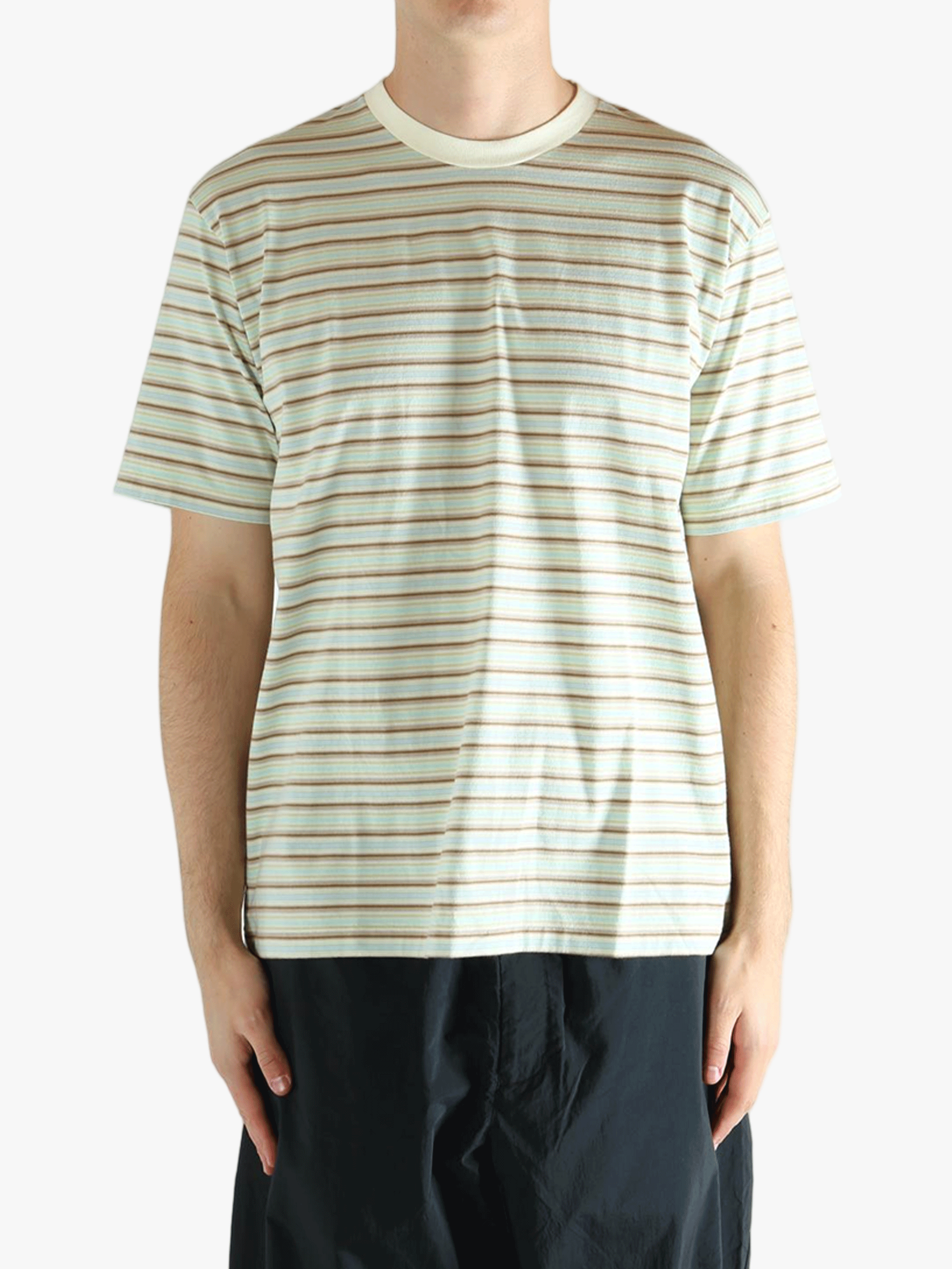 Green t-shirt worn by a person, showing the t-shirt's fit