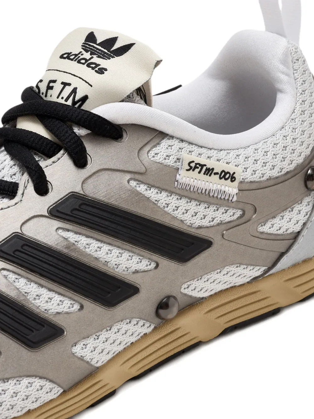 Close up of grey sneakers, showing texture of the fabric