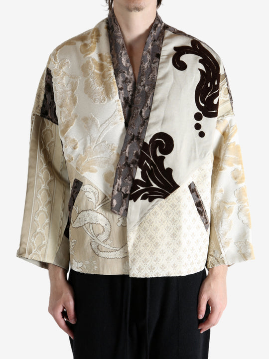 Tan coat worn by a person, showing the coat fit